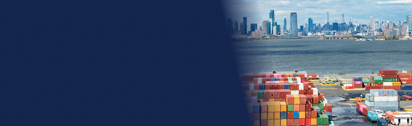 Aerial view of colorful shipping containers at the port of New York and New Jersey with the New York City skyline in the background 