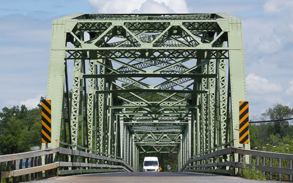 Two lane truss metal bridge in rural New York state