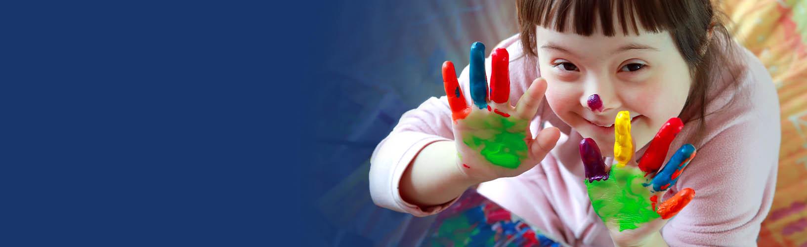 Young adolescent female child with paint on her hands