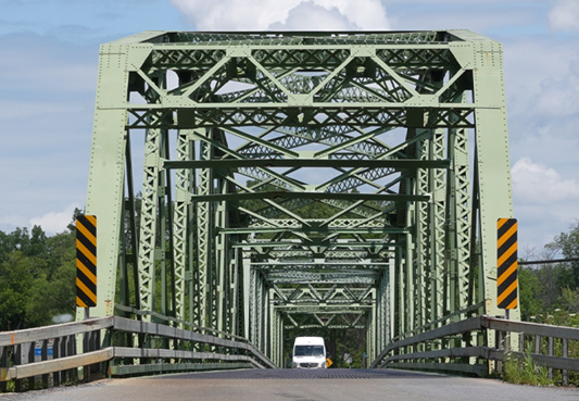 Two lane truss metal bridge in rural New York state