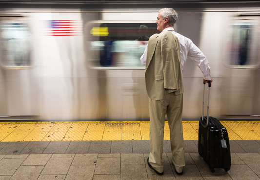 person standing in front of subway car