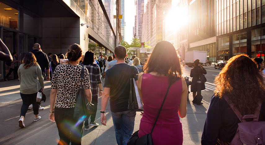 workers walking down sidewalk